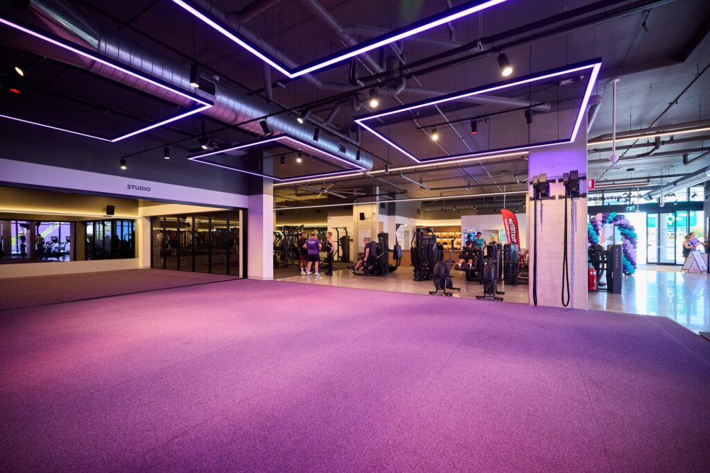 Purple-lit training studio at Anytime Fitness Cleveland
