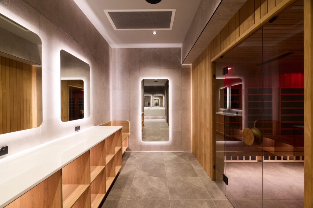 Timber and backlit mirror change rooms at Anytime Fitness Morayfield