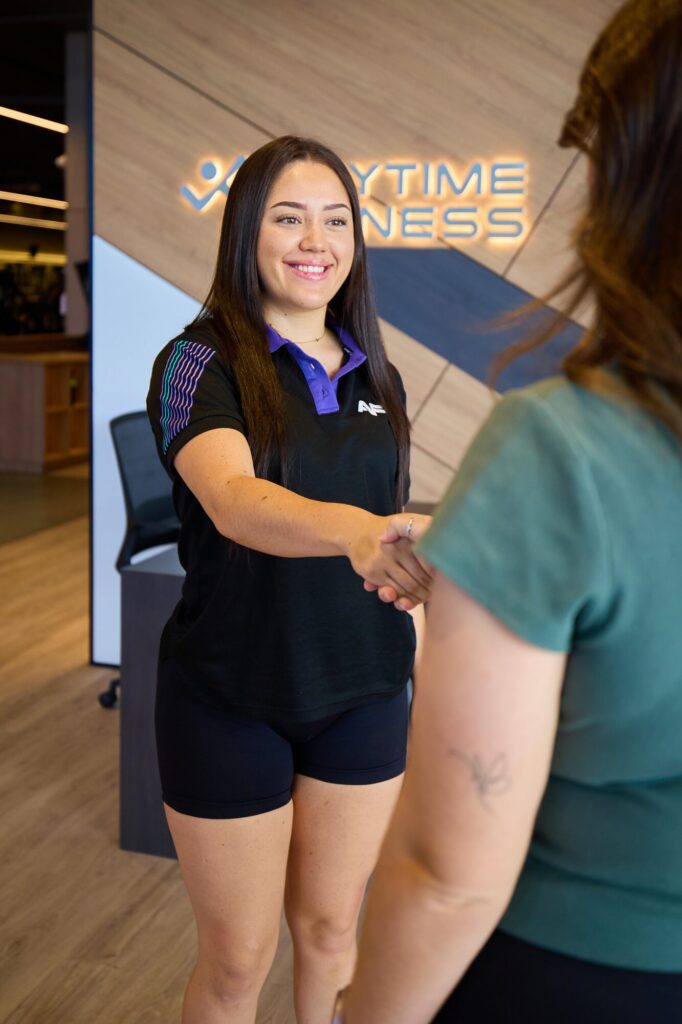 Newstead team member welcoming a new member with a handshake