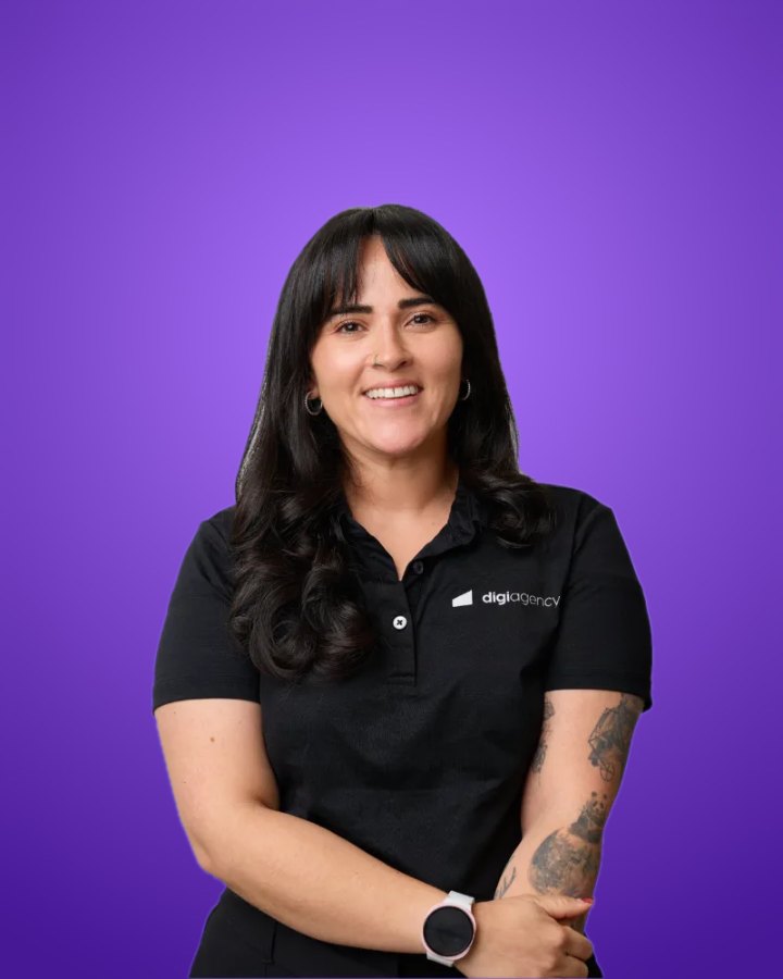 Professional team headshot of a Digi Agency team member, background swapped to brand purple